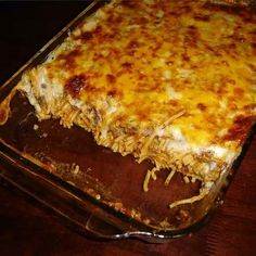 a casserole dish with cheese and meat in it