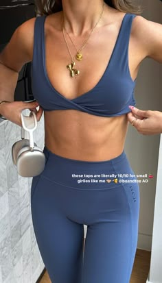 a woman in blue sports bra top and leggings