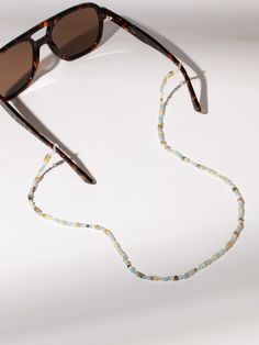 Keep your sunglasses right where you want them this summer with our Seaside Beaded Sunglasses Chain. Not only is this sunglasses chain functional, but it also matches all of your favorite beaded jewelry. Complete your sunglasses collection with all of our eyewear essentials. Beaded Sunglasses Chain, Beaded Sunglasses, Sunglasses Chain, Sunglass Chain, Sunglasses Collection, Jewelry Cleaner, Beauty Items, Cleaning Jewelry, This Summer