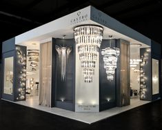 a white and black store with chandeliers on display