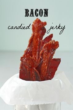 bacon is in a glass jar with the words bacon candied jeffy