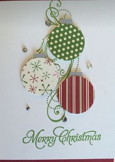 a christmas card with two ornaments on it