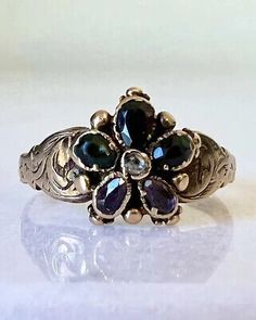 an antique ring with blue and white stones