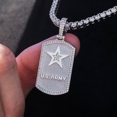 Introducing the U.S. Army Dog Tag Pendant, designed exclusively with the United States Army. Handcrafted in 14k White Gold, this pendant represents the courageous souls who safeguard our nation. The dog tag features the U.S. Army Logo with hand-set stones inside the star and an iced out border ensuring durability and long-lasting shine. Show your support and instill a sense of pride every time you wear this symbol of bravery and resilience. This product is guaranteed for life - GLD will repair t Tarnish Resistant Silver Dog Tag Jewelry, Tarnish Resistant Silver Dog Tag, Silver Laser Engraved Dog Tag Jewelry, Army Dog Tag, Army Dogs, Forever Products, Vermeil Jewelry, Custom Earrings, Metal Crafts