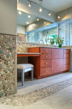 a bathroom with a sink, mirror and vanity in the middle of it's room