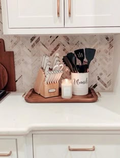 the kitchen counter is clean and ready to be used as a utensil holder