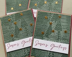 three christmas cards with gold stars on them and the words season's greetings