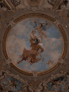 the ceiling is painted with an image of two cherubs