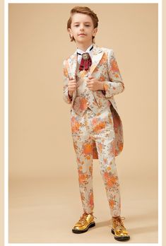 Traditional styling paired with modern chic. This 5-piece Floral Print Ensemble is both classical and flared with boulevardier adornments. Whether you find your family at a spring wedding reception or an exclusive summer banquet, your Petit Gentleman will be the center of attention. Our elegant Floral Print Ensemble comes with the Bouquet floral jacket, trousers, and matching vest, along with a brilliant white shirt that displays the signature royal red Victorian necktie. All 5 pieces are tailor Spring Wedding Reception, Boulevardier, Floral Jacket, Royal Red, Elegant Floral, Modern Chic, Spring Wedding, Necktie, White Shirt