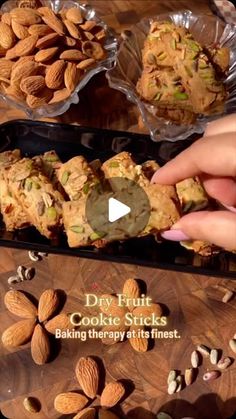 a person is holding some food in front of other foods on a wooden table with words describing how to make cookies and almonds