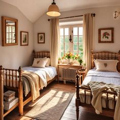 two twin beds in a bedroom with windows and rugs on the wooden flooring