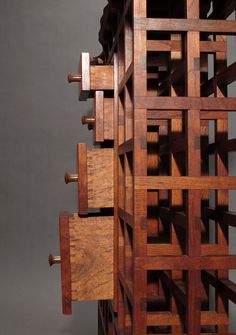 a wooden structure with multiple pieces of wood in the shape of squares and rectangles