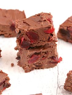 three pieces of chocolate fudge brownie stacked on top of each other