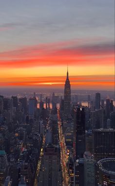 an aerial view of the city at sunset