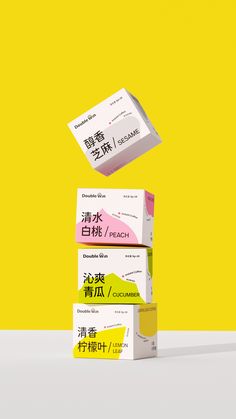 three boxes are stacked on top of each other in front of a yellow background with chinese characters