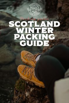 a person sitting on top of a rock next to the ocean with text overlay that reads scotland winter packing guide