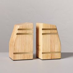 two pieces of wood sitting next to each other