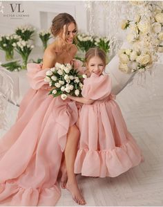 Gorgeous Mother and daughter dresses. Dusty pink mommy and me outfits.  Organza dresses for photoshoot girl and Mother.  Lush  short  sleeves dresses for winter holidays.  Blush Mommy and Me  wedding outfit. Save  a dresses set 2 .  Dresses maternity gown for photo shoot.   Flower girl  dress for girls. Princess Dress with ruffles.  Pregnancy dress in pink colour. Amazing dresses for mother and  daughter . Matching dresses. Beautiful  family look . Organza flower girl dress,  Organza mother dress,  Organza wedding dresses.  Princess party dres.  Princess Birthday dress.  Princess photoshoot dress.  Special occasions dress for girls.   Dressess made in organza sturdy material and feels very luxurious. Dress designed with a length to the floor . We can do any length you wish. The hem of this Dresses Photoshoot, Mum And Daughter Matching, Mother Daughter Dresses, Mother Daughter Wedding, Organza Flower Girl Dress, Organza Dresses, Mother Daughter Photoshoot, Mother Daughter Dresses Matching, Wedding Dress Organza