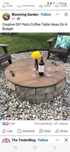 a table with two wine glasses on it and some flowers in vases next to the table