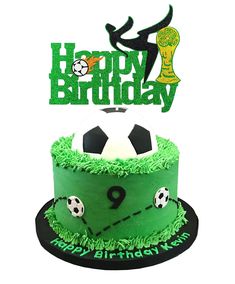 a soccer themed birthday cake with the number 9 on it's top and a green frosting