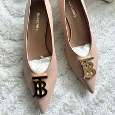 Burberry Ladies Heels. Sku: 8061405. Color: Nude. Shoe Style: Slip-On. Vamp Style: Metal Hardware. Upper Material: Leather. Solematerial: Leather. Burberry Nude Madelina 40 Tb Monogram Pumps. Made In Italy. Size 37.5 Eu Burberry Shoes, Walker Boots, Hot Shoes, Rain And Snow Boots, Fit N Flare Dress, Boot Sandals, Snow Boots, Shoe Style, Womens Heels