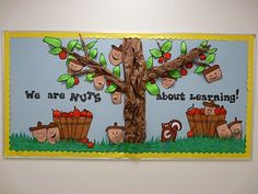 a bulletin board with an apple tree and monkeys on it that says, we are nuts about canning