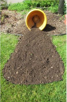 a pile of dirt sitting in the middle of a yard