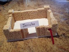 a piece of bread with the word jericho written on it sitting on a counter