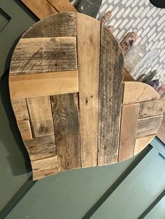 a wooden chair sitting on top of a table