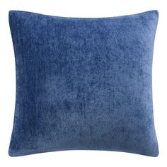 a blue velvet pillow on a white background