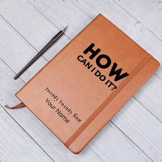 a brown notebook with the words how can i do it written on it and a pen next to it