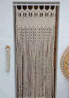 a wall hanging made out of macrame yarn