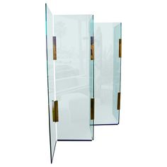 three glass partitions with wooden handles on each side