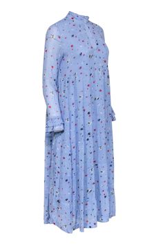 Let the garden come to you with this beautiful light blue Ganni dress! Boasting an eye-catching floral print detail, it's the perfect way to add a vibrant touch to your wardrobe. Dress up or down and enjoy the same stunning style! Size 4 (36) 100% Viscose Fully lined V-neckline Long sleeves Bust 42" Waist 50" Shoulder to hem 47" Sleeve length 23" Blue Printed Floral Dress For Garden Party, Blue Printed Midi Length Dress, Blue Printed Midi Dress For Garden Party, Light Blue Floral Print Dress, Light Blue Midi Dress For Spring Garden Party, Light Blue Midi Dress For Garden Party In Spring, Light Blue Floral Print Dress For Spring, Light Blue Flowy Midi Dress With Floral Print, Blue Floral Midi Dress For Spring