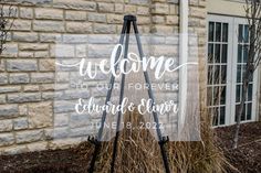 a welcome sign in front of a brick building with the words welcome to our forever