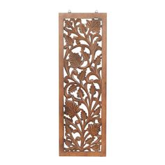 an ornate wooden panel with leaves and flowers on the front, hanging from a hook