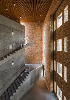 the inside of a building with stairs and windows