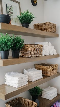 some shelves with towels and plants on them