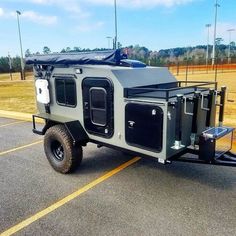 an off road utility vehicle parked in a parking lot