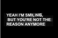 a black and white photo with the words yeah i'm smiling, but you're not the reason anymore