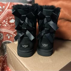 Size: 5 Color: Black Great Ugg Boots Perfect For Everyday Wear! Worn Only Two Times, Has A Small Mark On Top (Seen In Last Picture) Small Marks In The Front As Well Ugg Cleaner Will Do The Job Perfectly Uggs Bow, Ugg Cleaner, Ugg Boots With Bows, Cute Uggs, Uggs Black, Uggs Boots, Black Ugg Boots, Boot Bling, Bow Boots