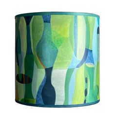 a lampshade with an abstract painting on it