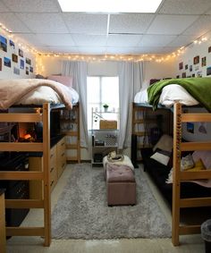 two bunk beds in a dorm room with lights on the ceiling and carpeted floor