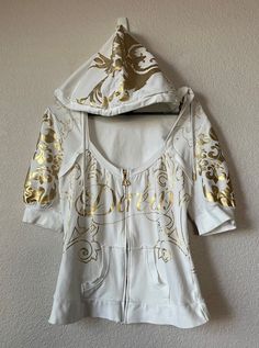 Beautiful cotton hoodie Two side pockets Gold floral pattern Material - 95% cotton 5% spandex Normal wear sign with ight stain on shoulder and right side of hoodie. Not noticeable Measurement - White Cotton Y2k Outerwear, Y2k White Cotton Outerwear, Fitted White Hoodie Sweatshirt, Y2k Fitted Hooded Hoodie, White Fitted Hoodie Sweatshirt, White Y2k Hoodie For Fall, White Fitted Cotton Sweatshirt, White Fitted Hoodie, White Y2k Hoodie For Spring