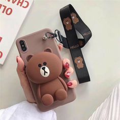 a person holding a phone case with a brown teddy bear on the front and side