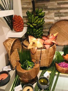 there are many different foods in baskets on the table