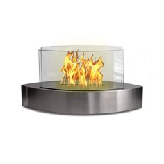 an outdoor fire pit with flames on the side and glass doors open to show it's bright flame