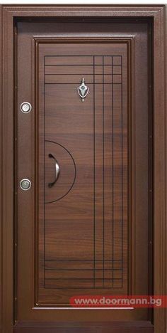 the front door is made from wood and has a metal handle