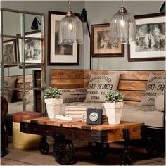 a living room filled with lots of furniture and pictures on the wall above it's coffee table