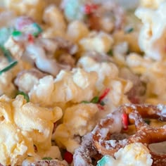 a close up of a plate of food with pretzels and candy